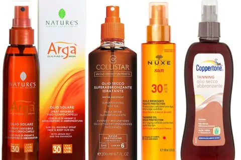 Vari oli abbronzanti, tra cui Nature's, Collistar, Nuxe e Coppertone, mostrano come funziona l'olio abbronzante per una pelle dorata e protetta.