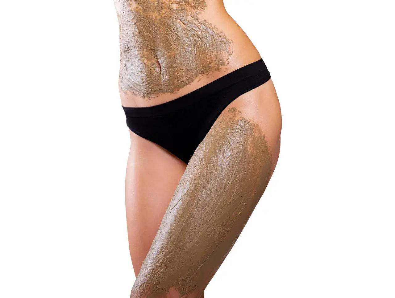 Corpo femminile con fanghi anticellulite applicati su addome e coscia. Quante volte a settimana per risultati ottimali?