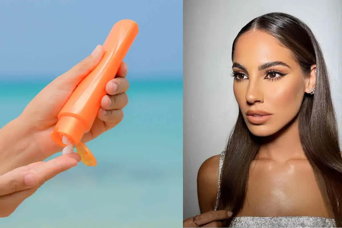 Mano con crema solare arancione, per godersi il sole in sicurezza. Si abbronza con la protezione 50, per una pelle protetta e luminosa.